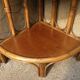 Varnished rattan corner shelf
