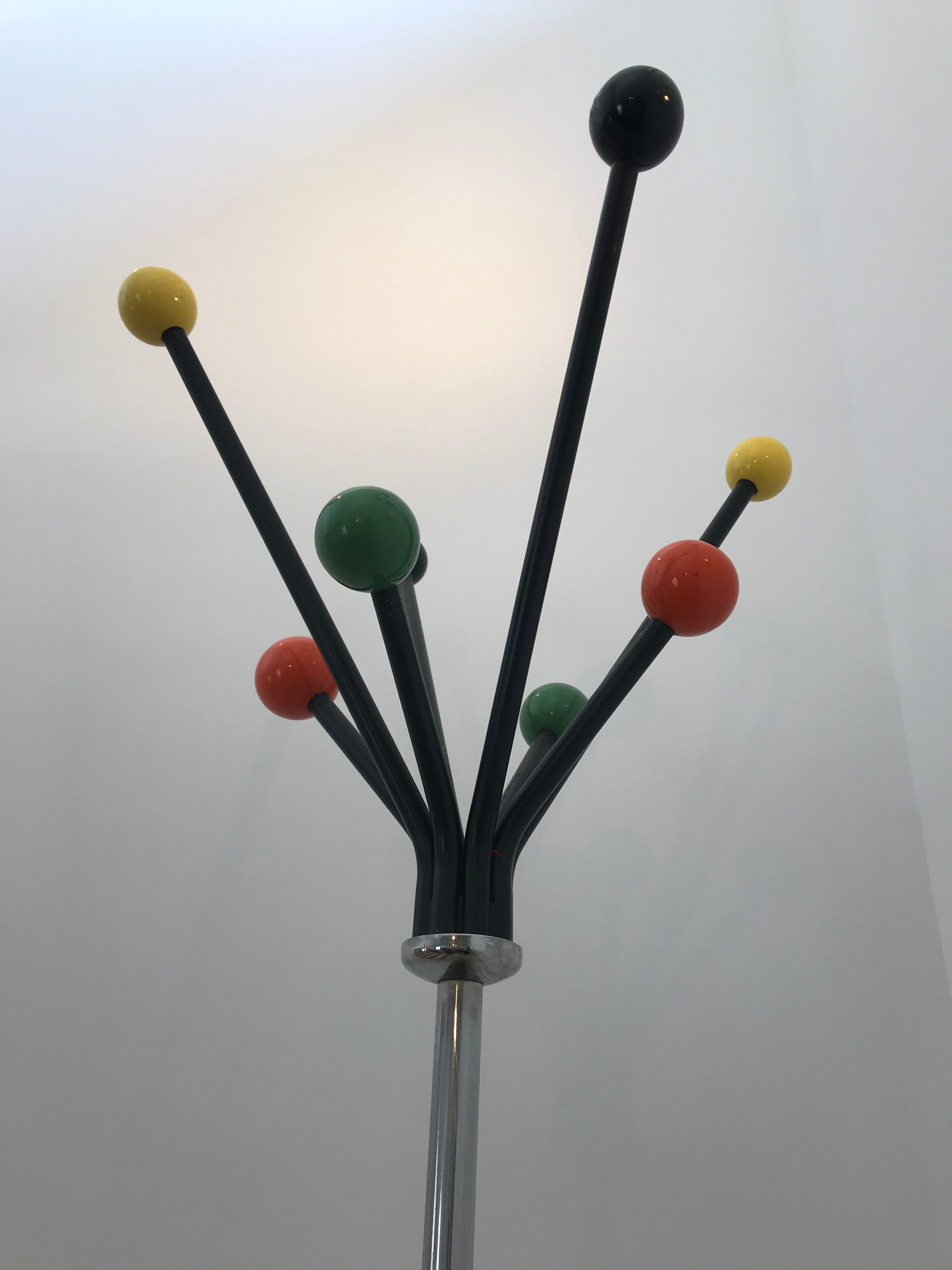 Wearing chrome parrot coat, black and multicolored balls