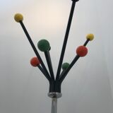 Wearing chrome parrot coat, black and multicolored balls