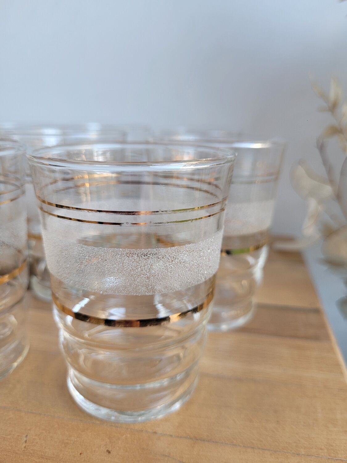 Set of 11 granite glass cups and golden edging