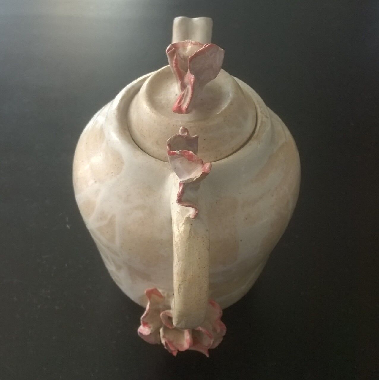 Vintage teapot with relief coral decoration.