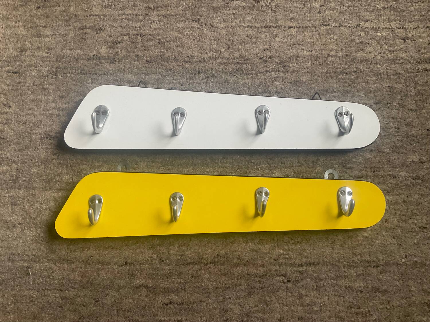 Duo of asymmetrical Formica coat racks from the 60s