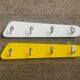 Duo of asymmetrical Formica coat racks from the 60s