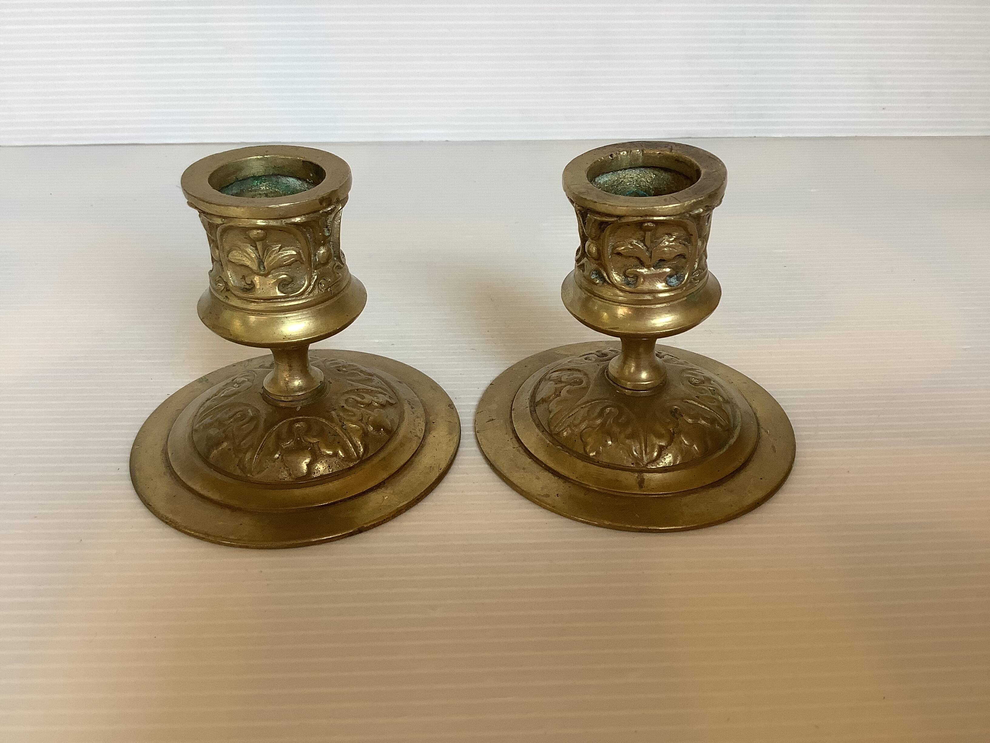 Pair of worked brass candlesticks
