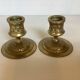 Pair of worked brass candlesticks