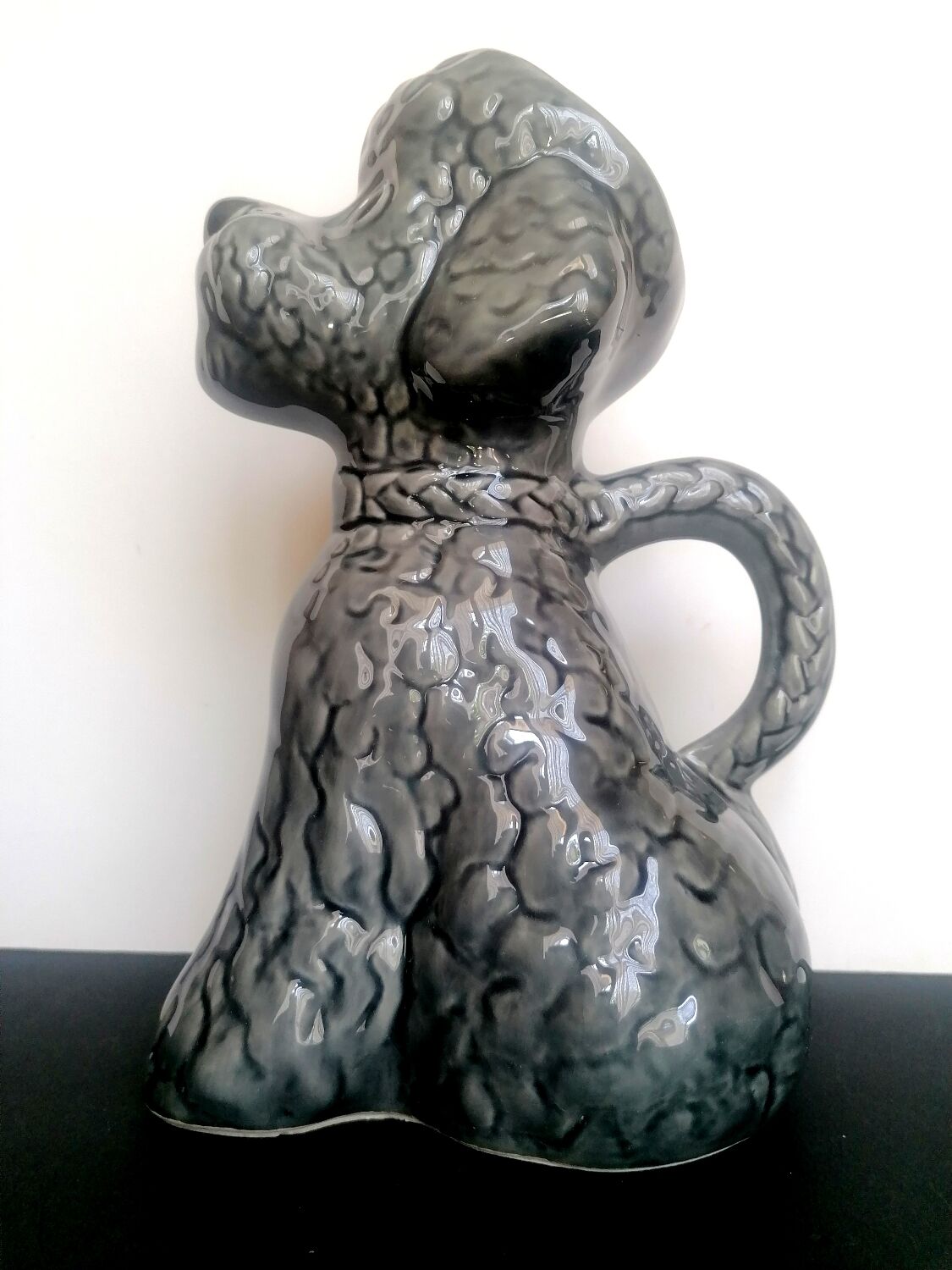 Zoomorphic pitcher slurry poodle