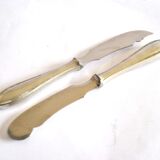 Two antique service knives in silver-plated metal, pearl frieze gowe alpacca.