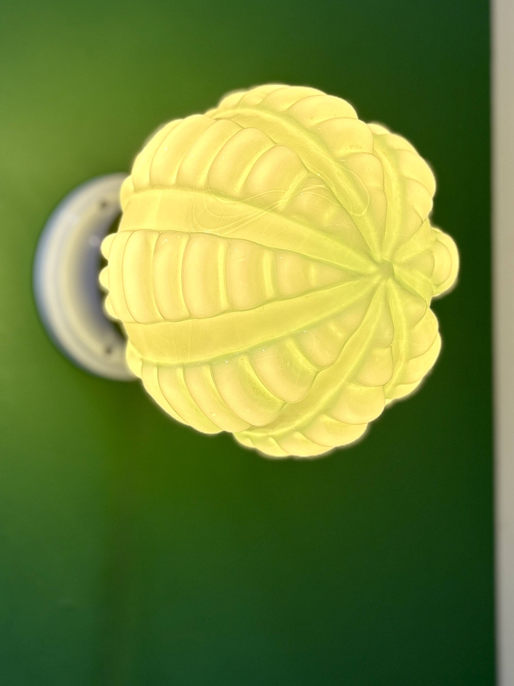 Vintage Art Deco globe wall light in pale green opaline.