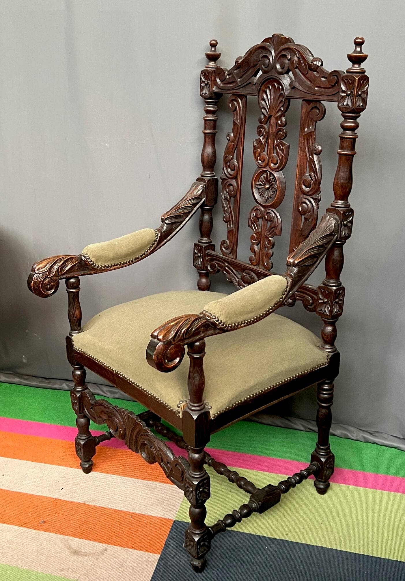 Renaissance-style oak armchair, hand-carved deep sculpture.
