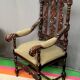 Renaissance-style oak armchair, hand-carved deep sculpture.