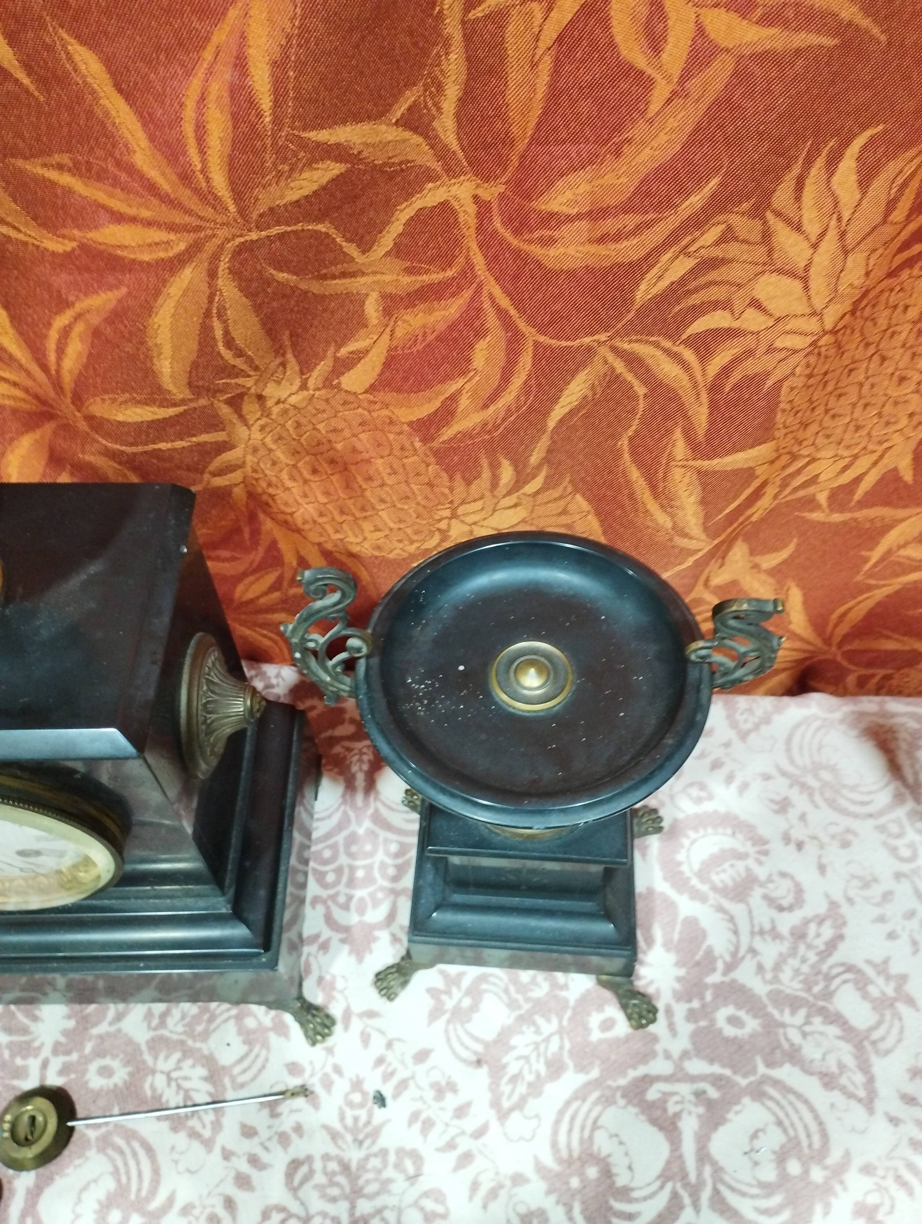 old Napoleon III marble fireplace surround with cups and pendulum