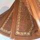 Library spiral staircase in beech and brown leather.