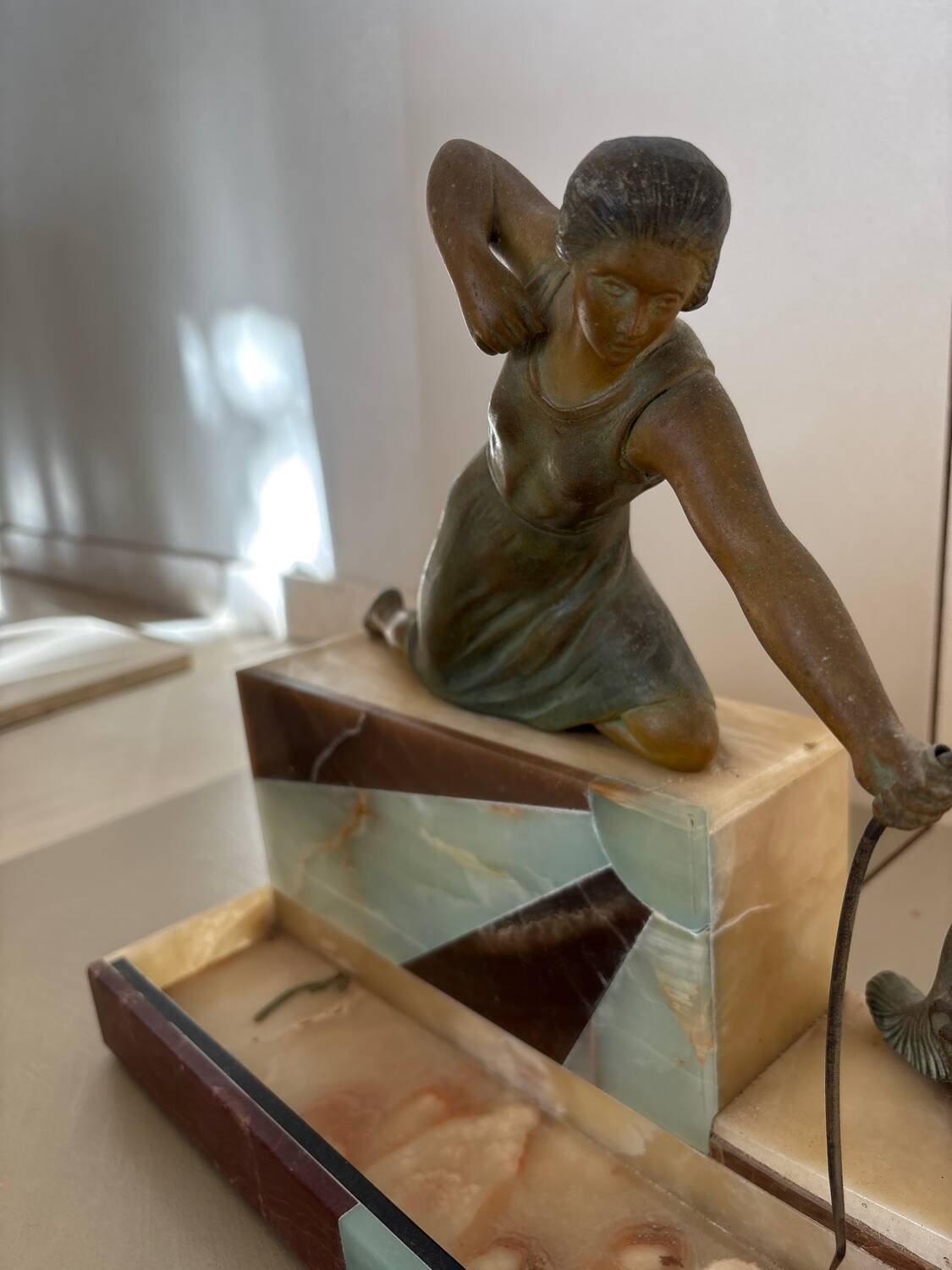Sculpture of a woman with a greyhound