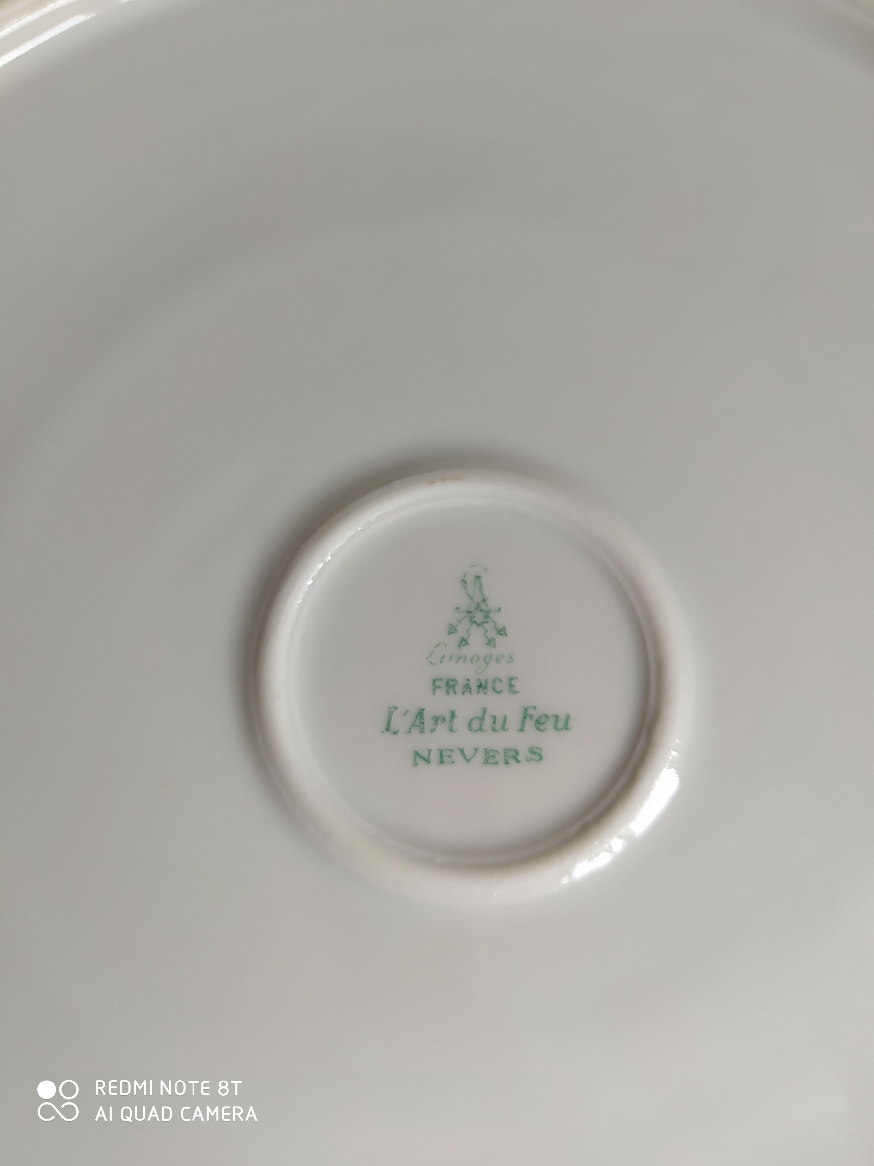 White Limoges porcelain table service with gold trim.