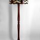 Art Deco floor lamp in carved walnut, stained glass shade, France, c. 1920
