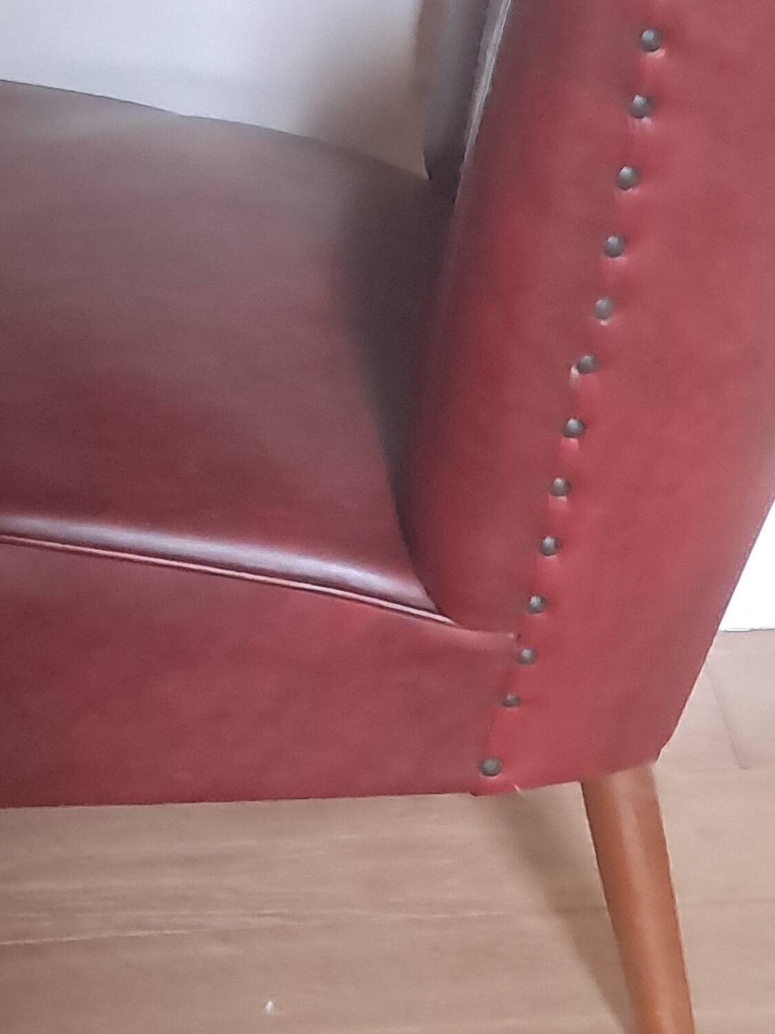 Burgundy leatherette cocktail chair, circa 1958
