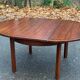 Scandinavian dining table and 4 Hans Olsen style chairs in teak and velvet.