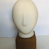 Ceramic head on wooden base