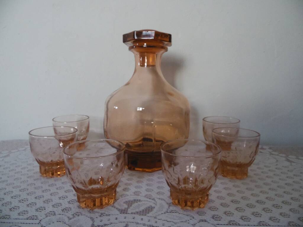 Pink glass liqueur carafe and 6 matching glasses