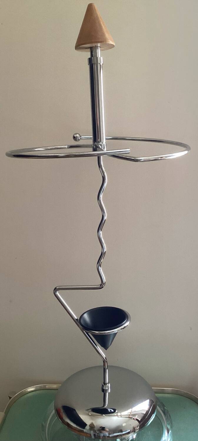 Designer umbrella stand in chrome metal and wood.