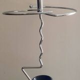 Designer umbrella stand in chrome metal and wood.