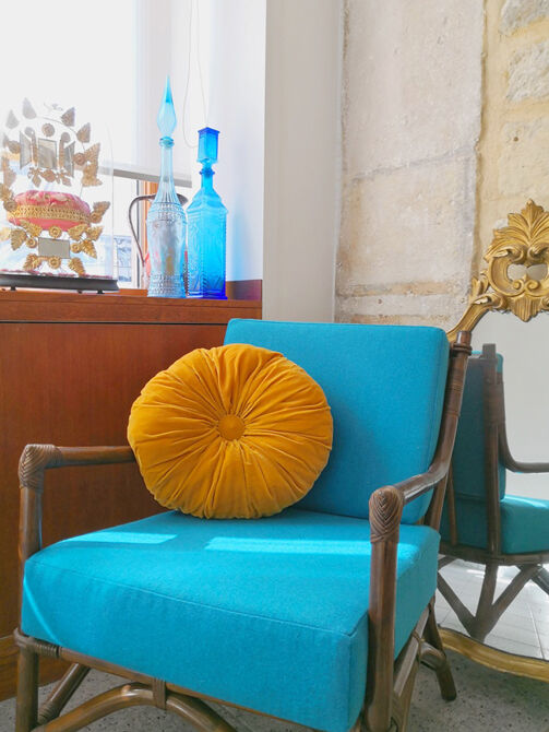 Yellow round velvet cushion