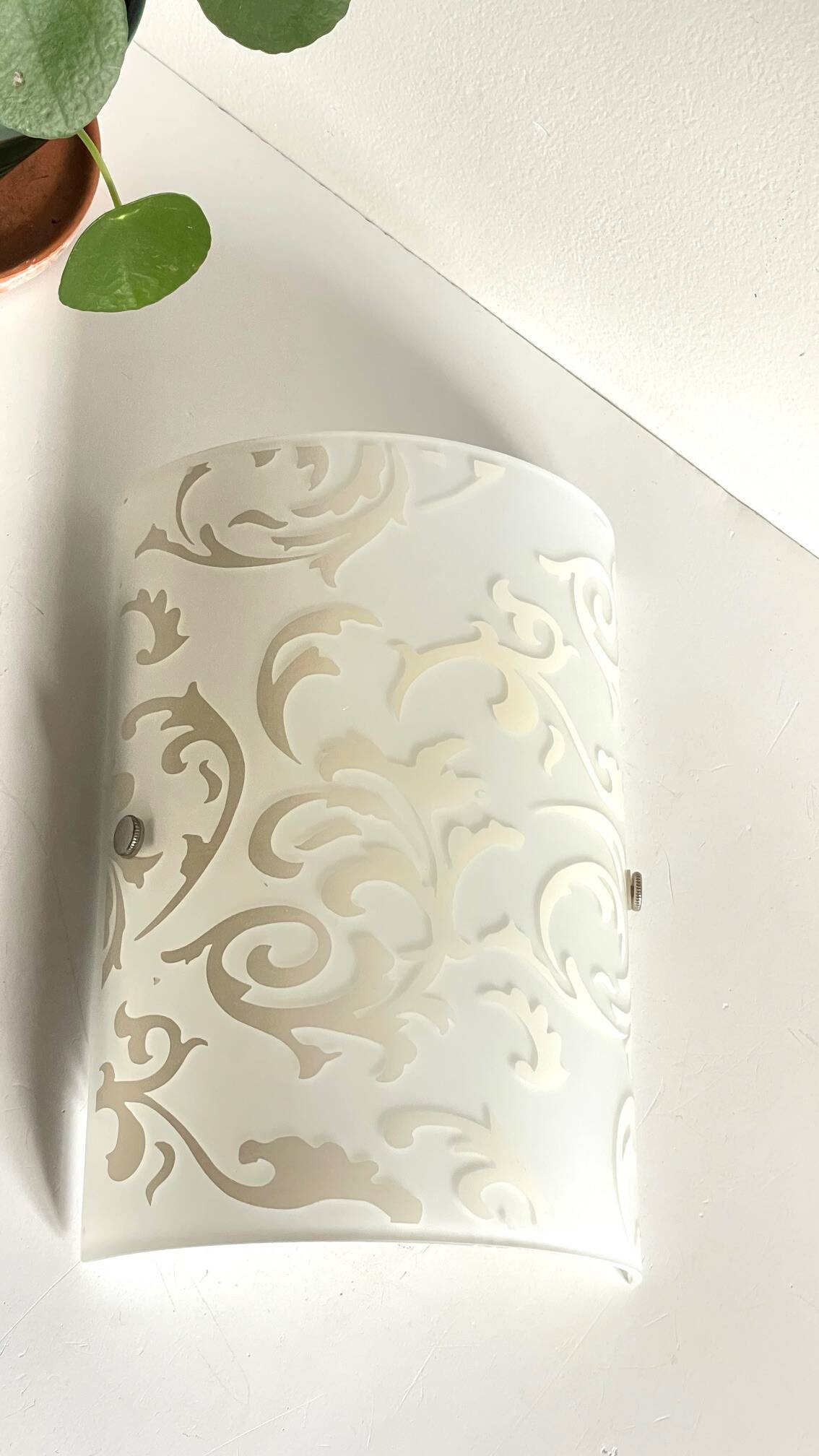 Polished and screen-printed glass sconce by eglo