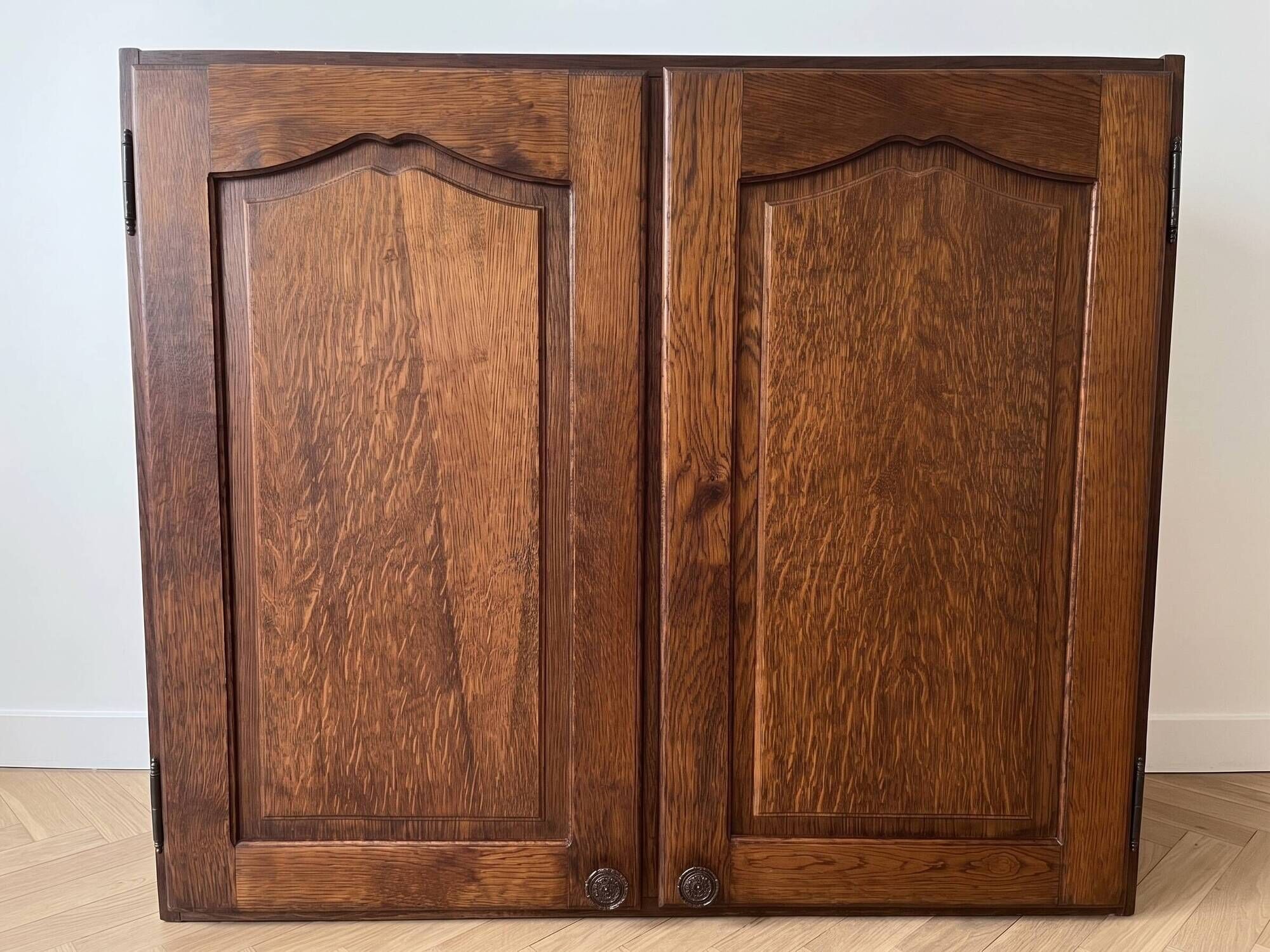 Set of chest of drawers and tall antique furniture in dark oak.