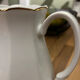 Vintage coffee pot in white porcelain with a gold trim.
