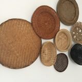 Wall composition of 8 baskets and wicker trays.