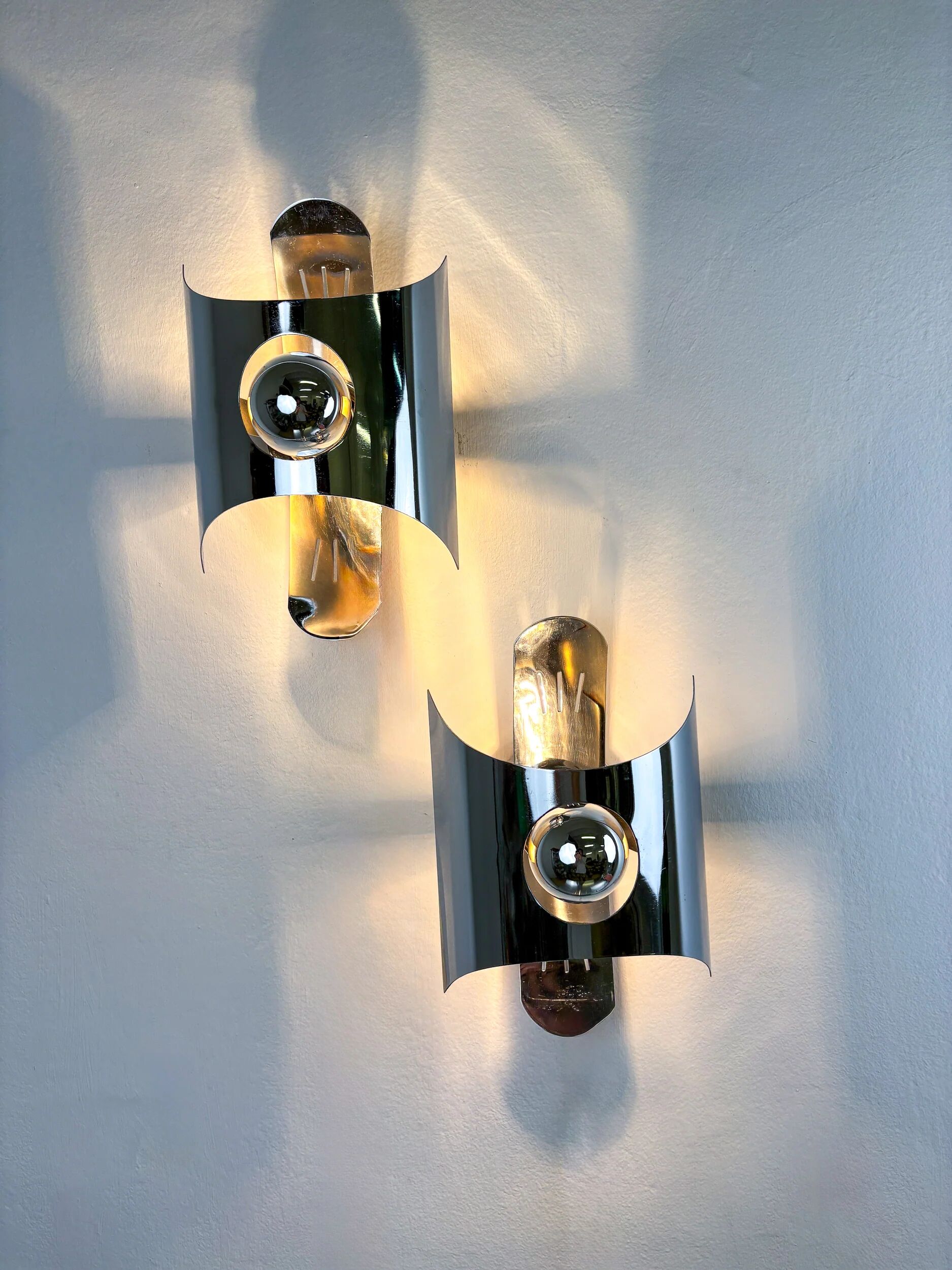 Pair of chromed space age wall lights, Italy, 1970s