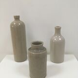 Trio of old sandstone bottles and jars