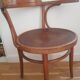 Wooden bistro chair with armrests