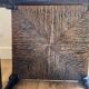 Corner chair made of turned wood with a straw seat.