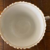 Porcelain cup with chiseled and gilded rim