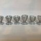 Six metal spiral spring egg cups