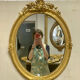 Miroir oval en bois doré 70x49cm