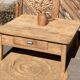 Large square farmhouse coffee table made of raw solid oak.