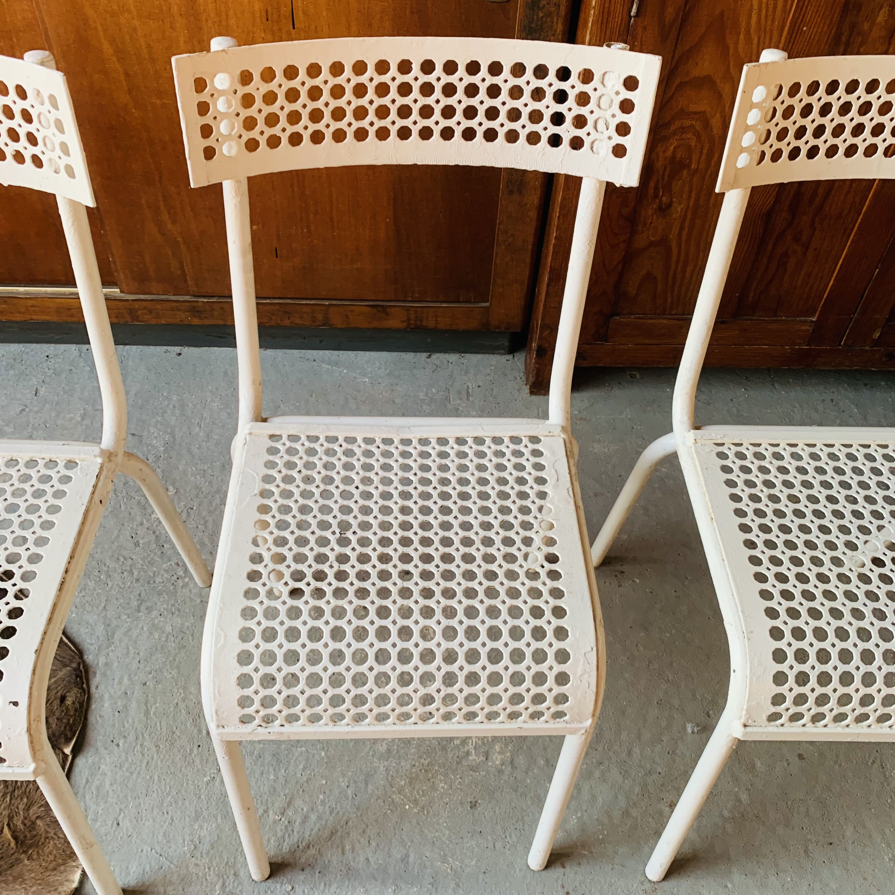 Series of 3 perforated metal chairs