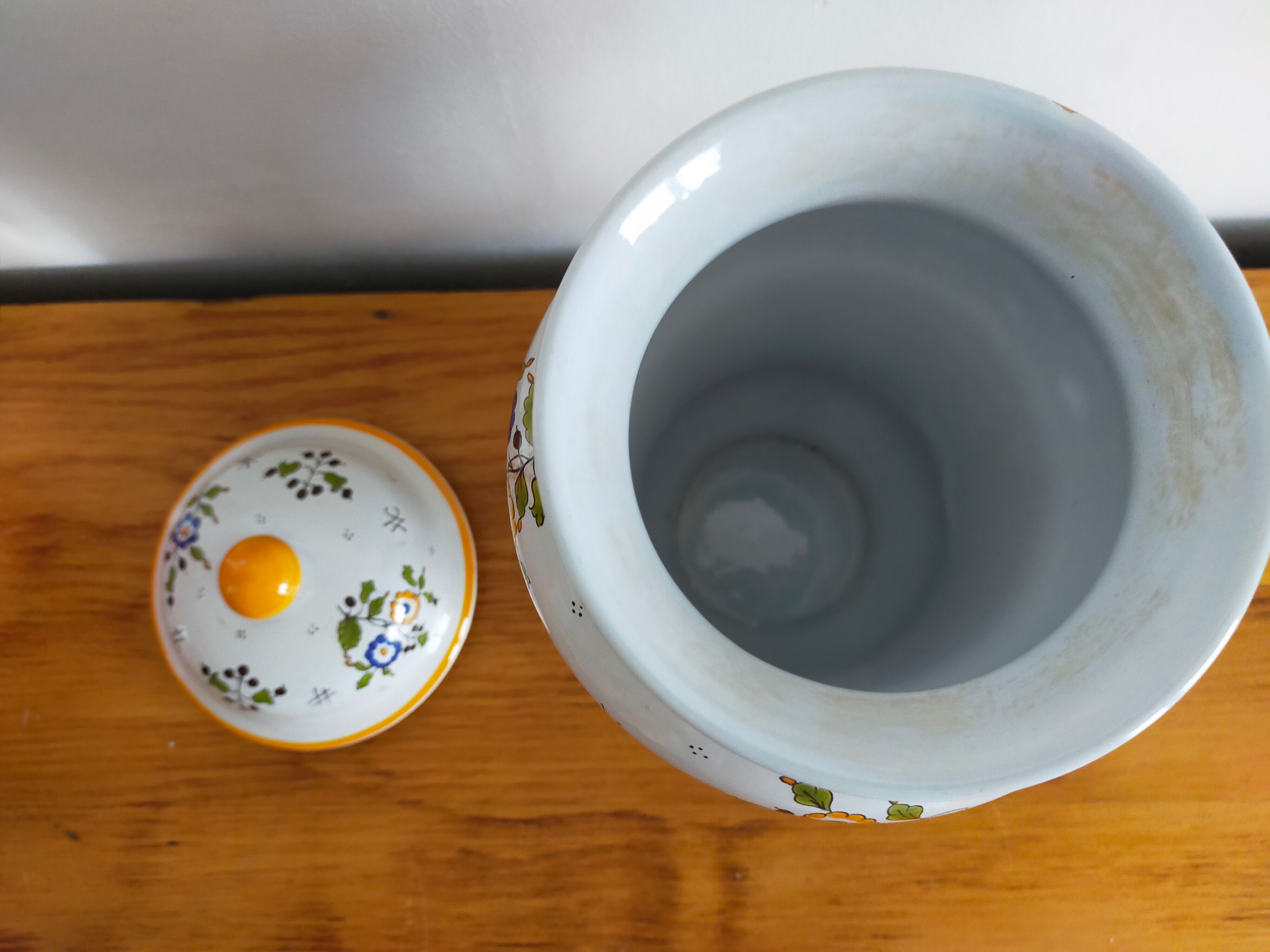 Vintage antique pharmacy jar in earthenware floral patterns