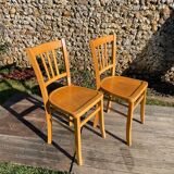 Pair of honey-colored luterma bistro chairs