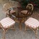dining table and chairs made of curved bamboo and rattan with smoked glass from the 1970s