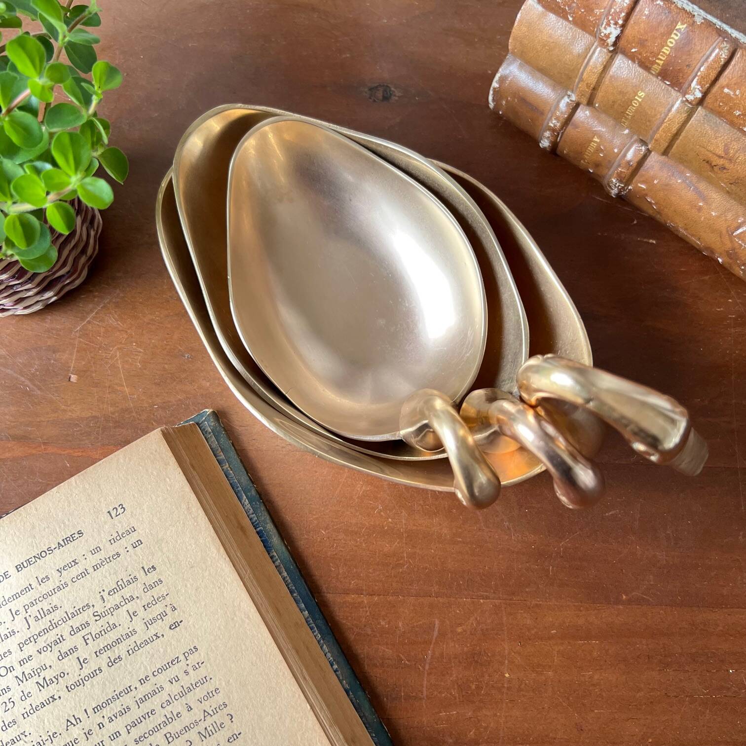 Trio of “swan” cups in gilded brass