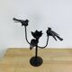 Brutalist wrought iron candle holder with birds