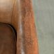 Vintage sheepskin club armchair finished with decorative nails