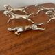 Set of 6 vintage galloping horse knife rests in silver-plated metal.