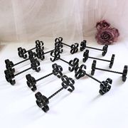 Box of 12 wrought iron cutlery holders