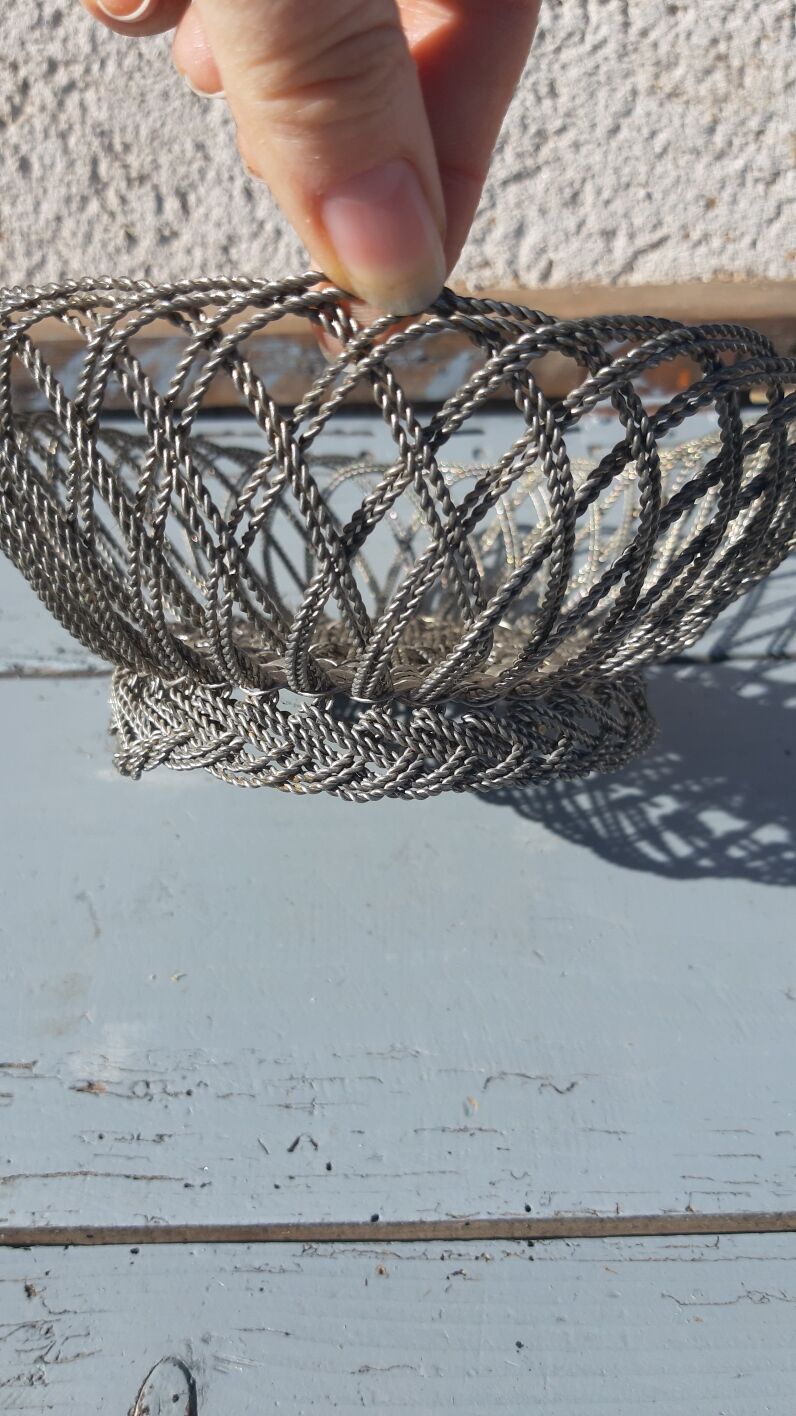 flat basket cut center table in woven metal