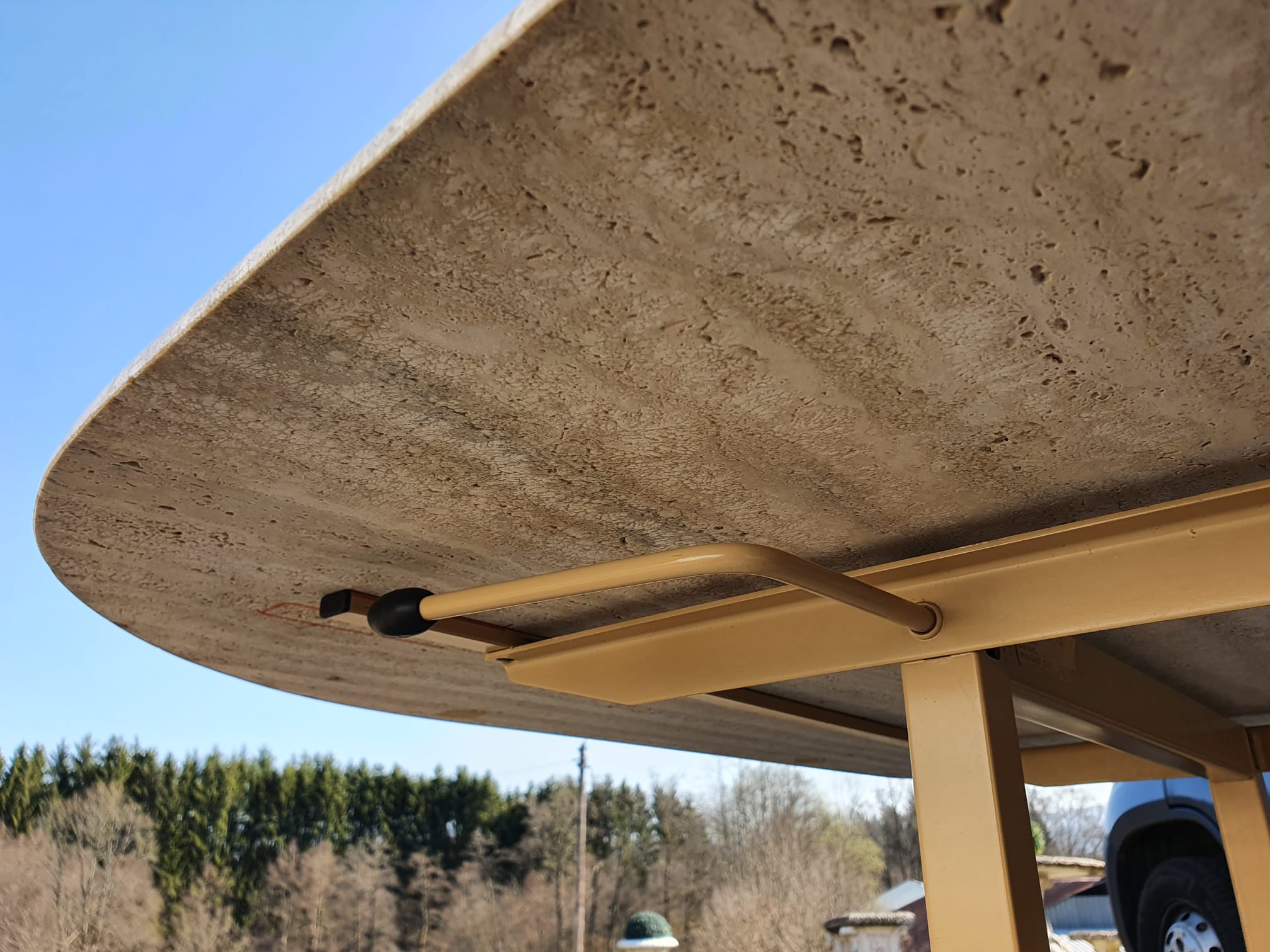 Adjustable travertine coffee table eye shape