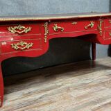Louis XV style curved center desk in red lacquer and gilded bronze